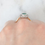 Anello a margherita antico in oro giallo 18K con tormalina verde (1ct ca.) e diamanti di taglio vecchia miniera (0.50ctw ca.), anni ‘20/‘30