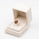 Anello vintage a margherita in oro giallo 8k e granati, anni '70