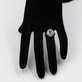 Bague vintage en platine en forme de marguerite avec opale (1,22 ct) et diamants (0,38 ct au total)