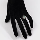 Bague vintage en platine en forme de marguerite avec opale (1,22 ct) et diamants (0,38 ct au total)