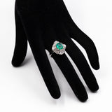ANELLO A BALLERINA IN PLATINO 900 CON SMERALDO CENTRALE (1.80 CT) E DIAMANTI (1.05CT)