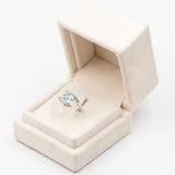 Vintage "bypass" ring in 9k white oto with blue topaz and diamonds