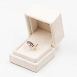 9k yellow gold ring with iolites and diamonds