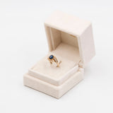 ANELLO TOURBILLON VINTAGE IN ORO GIALLO 14K CON ZAFFIRO (1.20CT CA.) E DIAMANTI (0.29CTW CA.), ANNI ‘80