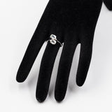 Anello vintage bypass in oro bianco 9k con hiddeniti e diamanti