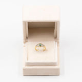 Vintage 18K yellow gold ring with emerald (0.20ct approx.) and brilliant cut diamonds, 70s