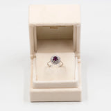 Anello vintage a margherita in oro bianco 18k con rubino (0,80ct) e diamanti (0,70ctw)