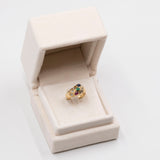 Vintage-Ring aus 18 Karat Gelbgold mit Rubin, Saphir, Smaragd und Diamant (0.30 ctw), 70er Jahre