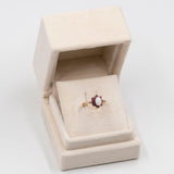 Anello vintage in oro giallo 9k con opale (0,50ct) e rubini (0,50ctw)