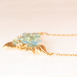 Vintage 9K yellow gold necklace with green glass paste in the shape of flowers, gold petals and white stones, 80s/90s