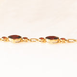 Vintage 8K yellow gold semi-rigid bracelet with garnets (approx. 7ctw), 60s/70s