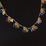 Vintage 18K yellow gold necklace with pendant heart-shaped decorations with red, orange, green and blue enamels, 70s