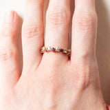 Halbe Ewigkeit aus 18-karätigem Gelbgold mit Rubinen (ca. 0.60 ctw) und Diamanten im Brillantschliff (ca. 0.42 ctw), 70er/80er Jahre