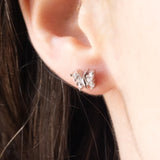 Boucles d'oreilles papillon modernes en or blanc 9K avec diamants taille brillant (env. 0.16 ct)