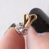 Vintage-Lichtpunkt-Anhänger aus 9 Karat Gelb- und Weißgold mit Diamant im Brillantschliff (ca. 0.15 ct), 70er/80er Jahre