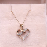 Collana vintage con ciondolo a cuore in oro giallo 9k e diamanti