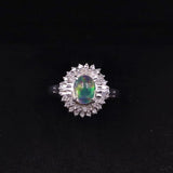 Bague vintage en platine en forme de marguerite avec opale (1,22 ct) et diamants (0,38 ct au total)