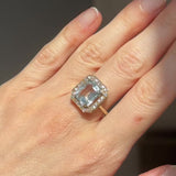 Anello a margherita vintage in oro giallo 14K con acquamarina (3.30ct ca.) e diamanti (0.22ctw ca.), anni ‘70