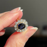 Anello a margherita vintage in oro 18K con zaffiro (1.10ct ca.) e diamanti di taglio brillante (0.50ctw ca.), anni ‘60