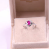 ANELLO A MARGHERITA IN PLATINO CON RUBINO (1.011 CT) E DIAMANTI (0.70 CTW)