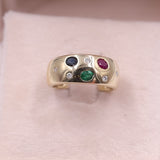 Bague vintage en or jaune 14 carats avec saphir, rubis, émeraude et diamants. Années 70