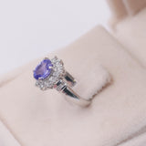 ANELLO A MARGHERITA VINTAGE IN PLATINO CON TANZANITE (1CT) E DIAMANTI (0.50CTW)
