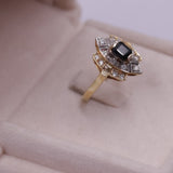 Vintage-Ring aus 14-karätigem zweifarbigem Gold mit zentralem Saphir (0.60 ct) und Diamanten (0.16 ctw), 80er Jahre