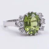 Vintage ring in 18k gold with 5.60ct olivine and diamonds (0.38ctw), 1970s