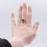 Vintage ring in 18K gold with orange garnet (approx. 6.60 ct) and diamonds (approx. 0.70 ct), 1960s