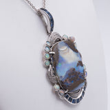 VINTAGE PENDANT IN 18K WHITE GOLD WITH OPAL BOULDER, DIAMONDS AND SAPPHIRES. WHITE GOLD CHAIN WITH OPALS. 40S