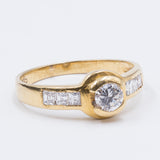 Bague vintage en or 18 carats avec diamant central (0,30 ct) et diamants latéraux, 1960