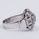 Art Decò ring in 18k gold with old cut diamonds (0.60ct) and rosettes, 30s
