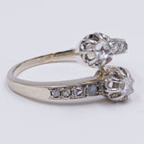 Antique contrarier ring in 18k white gold with rosette cut diamonds, 30s