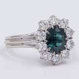 Vintage Gänseblümchen-Ring aus 18 Karat Weißgold mit Saphir (ca. 1.10 Karat) und Diamanten im Brillantschliff (ca. 1 Karat), 60er