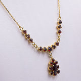 Vintage 14k yellow gold necklace with garnets, 60s