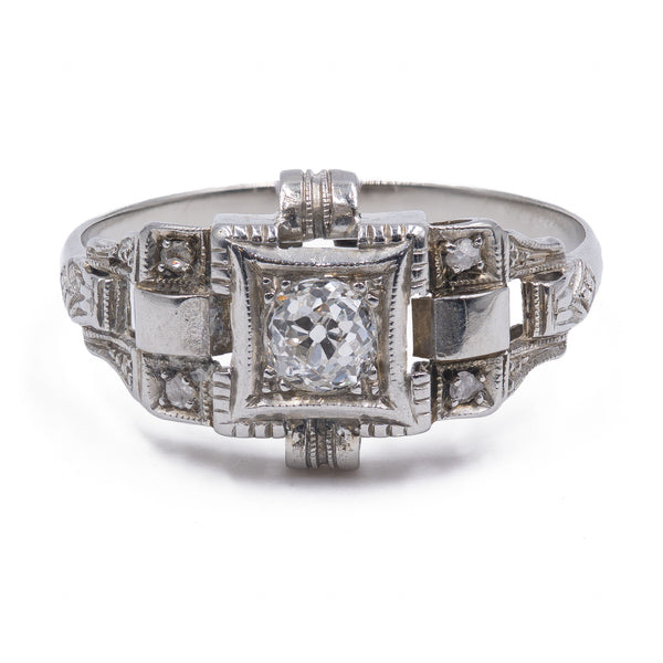 Anello Art Decò in platino con diamante taglio vecchia miniera ( 0,20ct) e rosette, anni '30