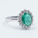 18k gold ring with emerald (1.6 ct) and brilliant cut diamonds outline (0.55 ct)