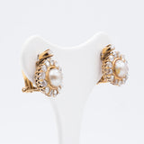 Clip earrings in 18K gold with diamond and pearl rosettes, early 1900s