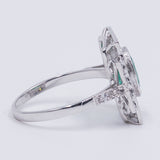 18k white gold ring with central emerald (1.30 ct) and brilliant cut diamonds (0.48 ctw)