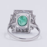 18k white gold ring with central emerald (1.30 ct) and brilliant cut diamonds (0.48 ctw)