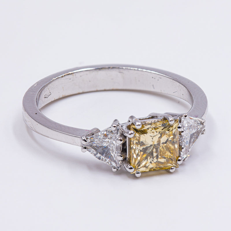 18k white gold ring with fancy yellow diamond (1ct) and triangular side diamonds (0.60ctw)
