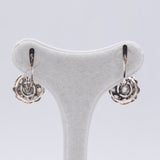 Antique 12k gold and silver earrings with diamond rosettes, early 900s