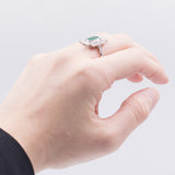 18k white gold ring with central emerald (1.30 ct) and brilliant cut diamonds (0.48 ctw)