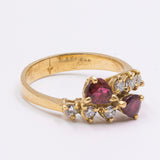 Vintage 18K yellow gold ring with diamonds (0.20ctw approx.) And pear cut rubies, 70s / 80s