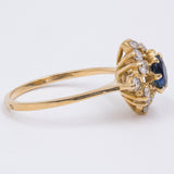 Vintage 18k yellow gold ring with central sapphire and diamonds (0.50ctw), 1970s