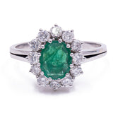 18kt gold daisy ring with emerald (2.20ct) and diamonds (1ct), 1960s