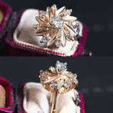 Anello vintage in oro 14K con diamanti di taglio brillante (centrale da 0.27ct ca.), anni '70