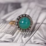 Antiker Ring aus 18-karätigem Gold mit türkisfarbener Glaspaste und Diamantrosetten, Anfang des 900. Jahrhunderts – Antichità Galliera