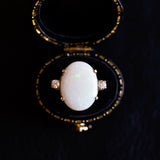 Vintage 18K gold ring with cabochon cut opal (approx. 5ct) and brilliant cut diamonds (approx. 0.20ctw), 60s / 70s