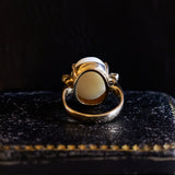 Vintage 18K gold ring with cabochon cut opal (approx. 5ct) and brilliant cut diamonds (approx. 0.20ctw), 60s / 70s